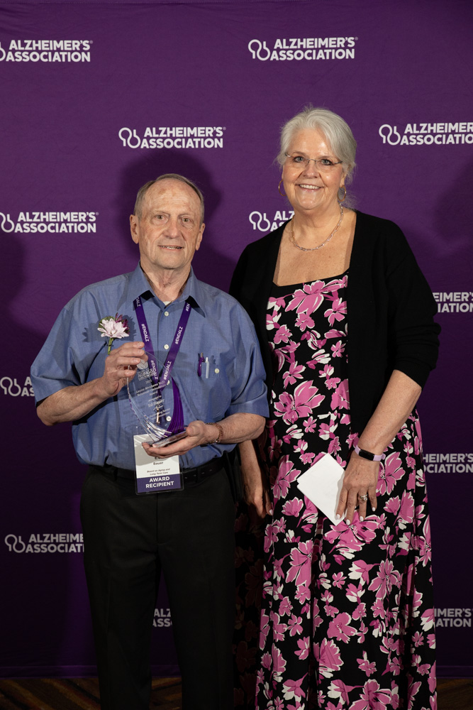 Volunteer Ed Bauer and Board President Dr. Valerie Palarski with the LAY Award