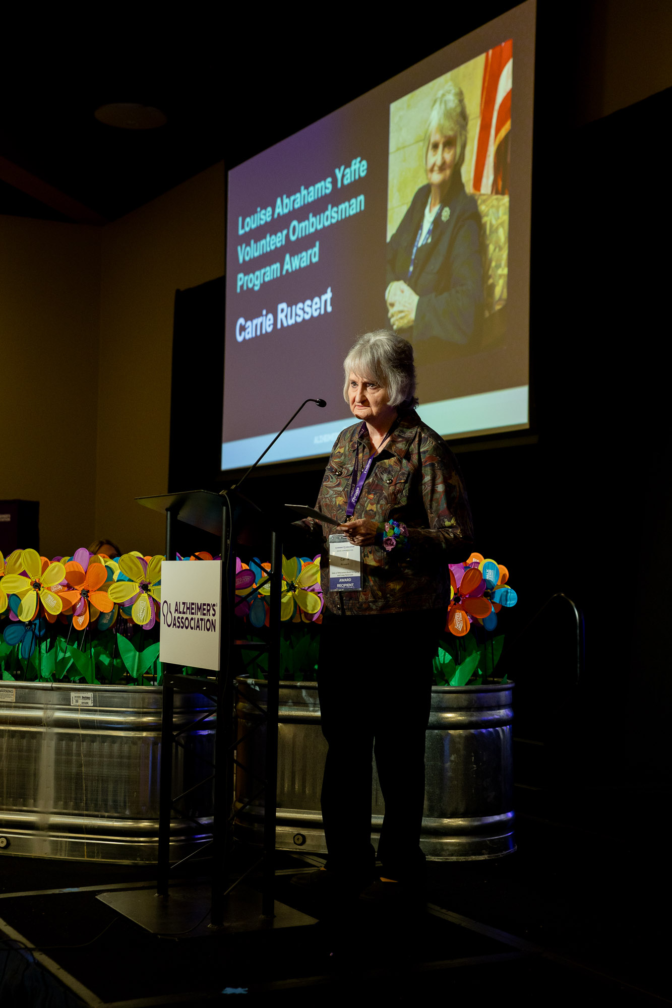 Carrie Russert receives her award on stage at the Alzheimer's Association Conference